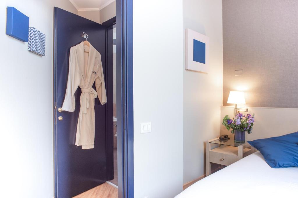 Postel nebo postele na pokoji v ubytování Hotel Oro Blu