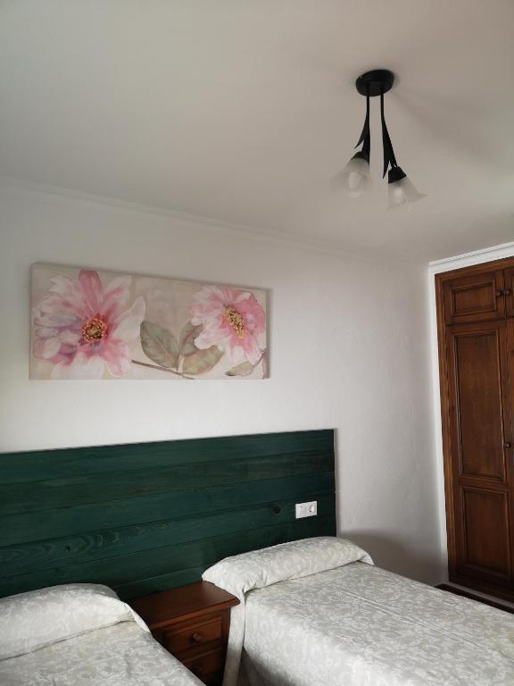 Postel nebo postele na pokoji v ubytování Pensión Venta Julián HCA01134