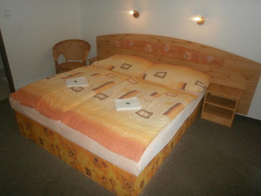 Letto o letti in una camera di Hotel Fogl