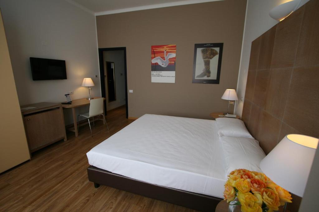 Postel nebo postele na pokoji v ubytování Hotel Oro Blu