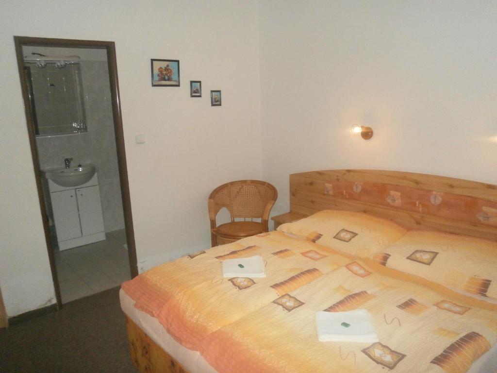 Letto o letti in una camera di Hotel Fogl