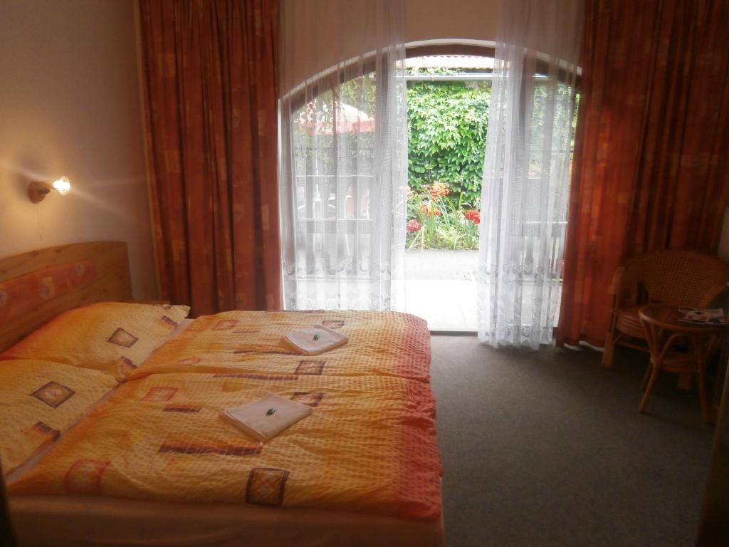 Letto o letti in una camera di Hotel Fogl