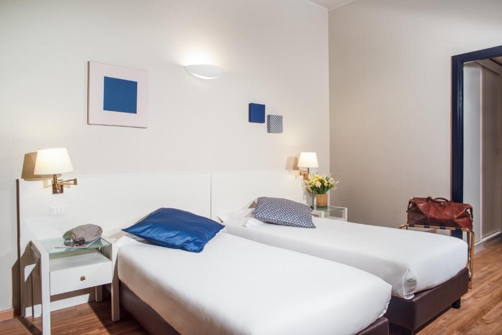 Postel nebo postele na pokoji v ubytování Hotel Oro Blu