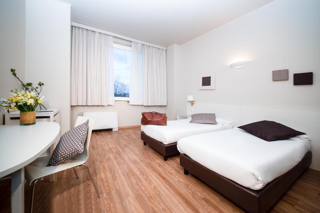 Postel nebo postele na pokoji v ubytování Hotel Oro Blu