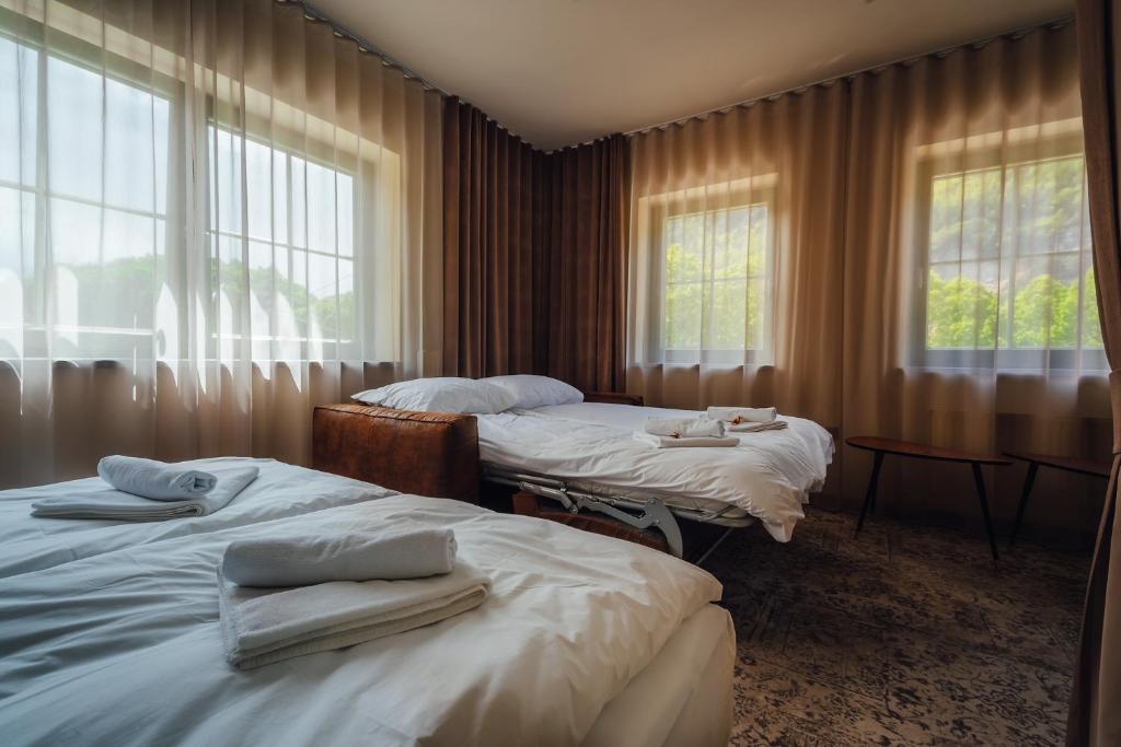 Postel nebo postele na pokoji v ubytování Guest House EJGA