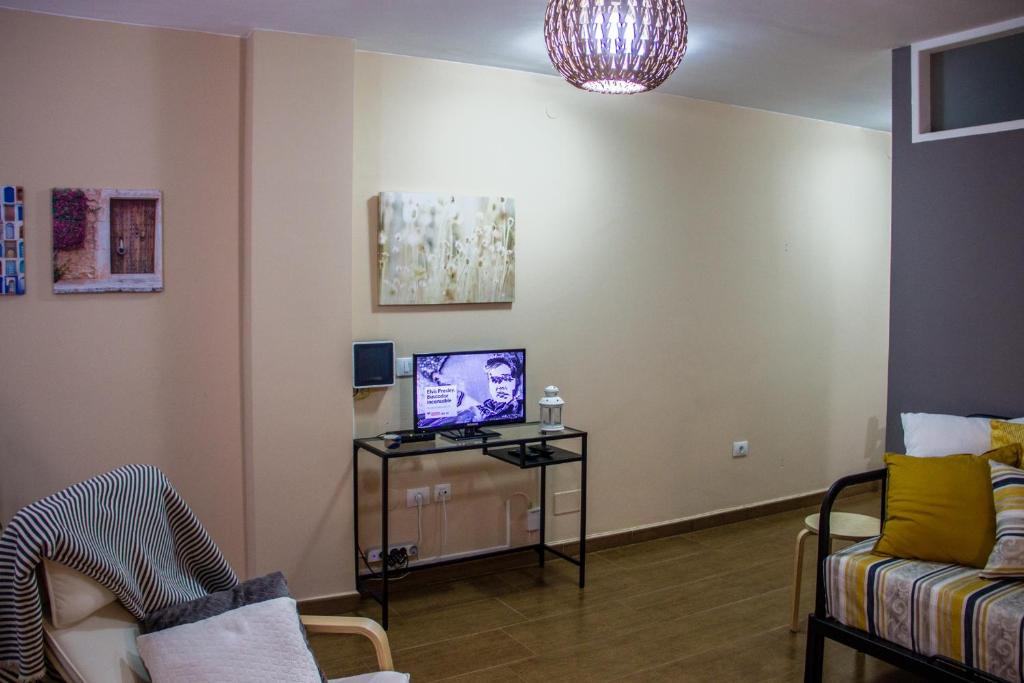 TV a/nebo společenská místnost v ubytování Acogedor apartamento con vista al mar