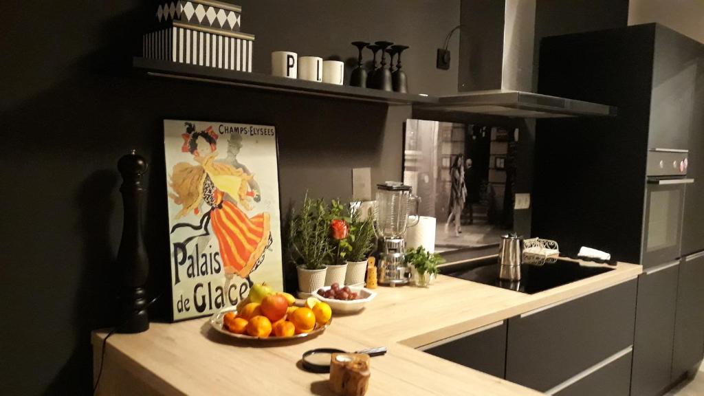 a kitchen counter with a bowl of fruit on it at Luxury Old Town Apartment Pula in Pula