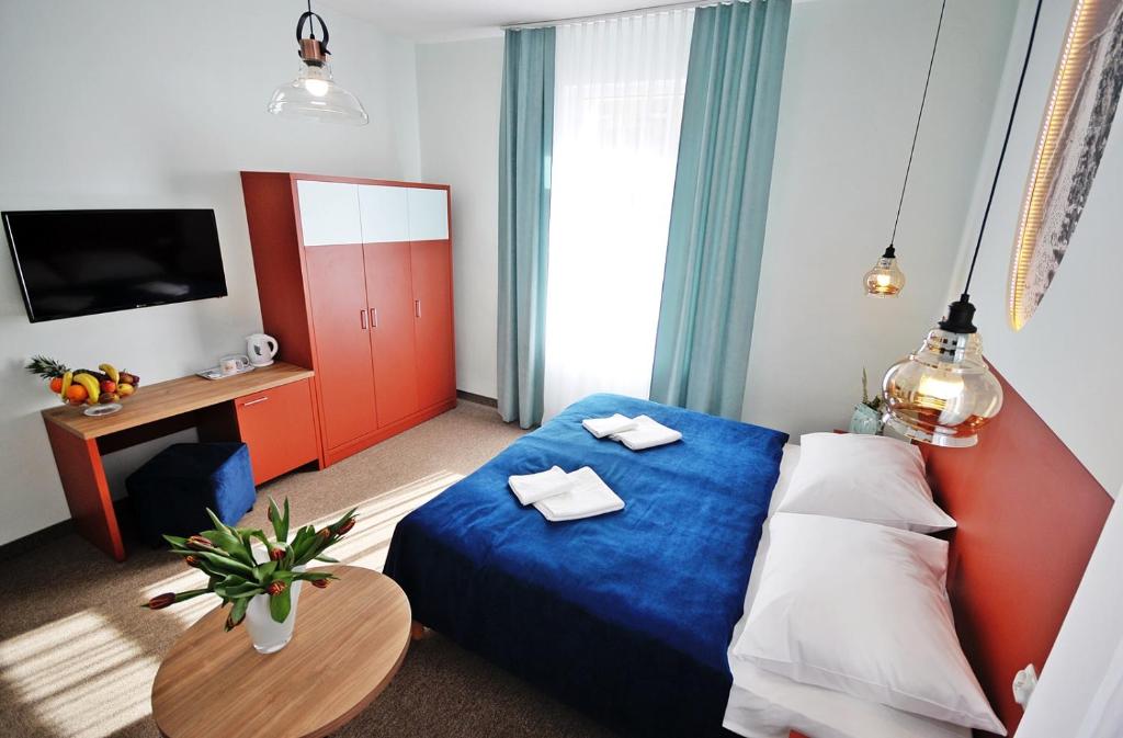 Postel nebo postele na pokoji v ubytování Dom Zdrojowy Amber