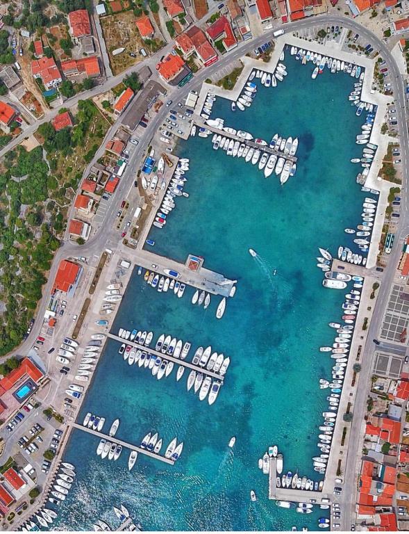 an aerial view of a marina with boats in the water at Villa Ines in Jezera