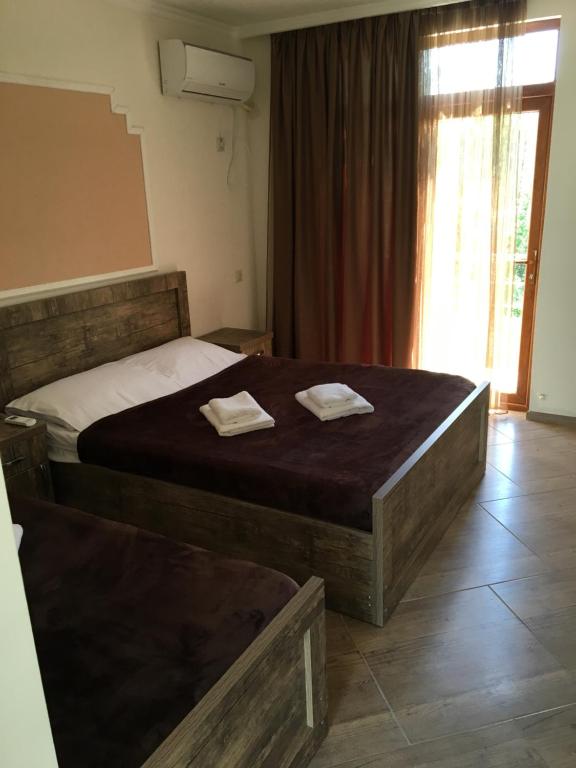 Postel nebo postele na pokoji v ubytování Cottages Ureki