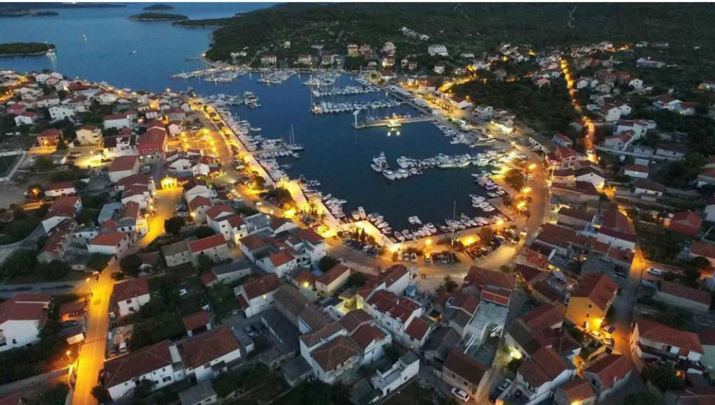 an aerial view of a harbor at night at Villa Ines in Jezera