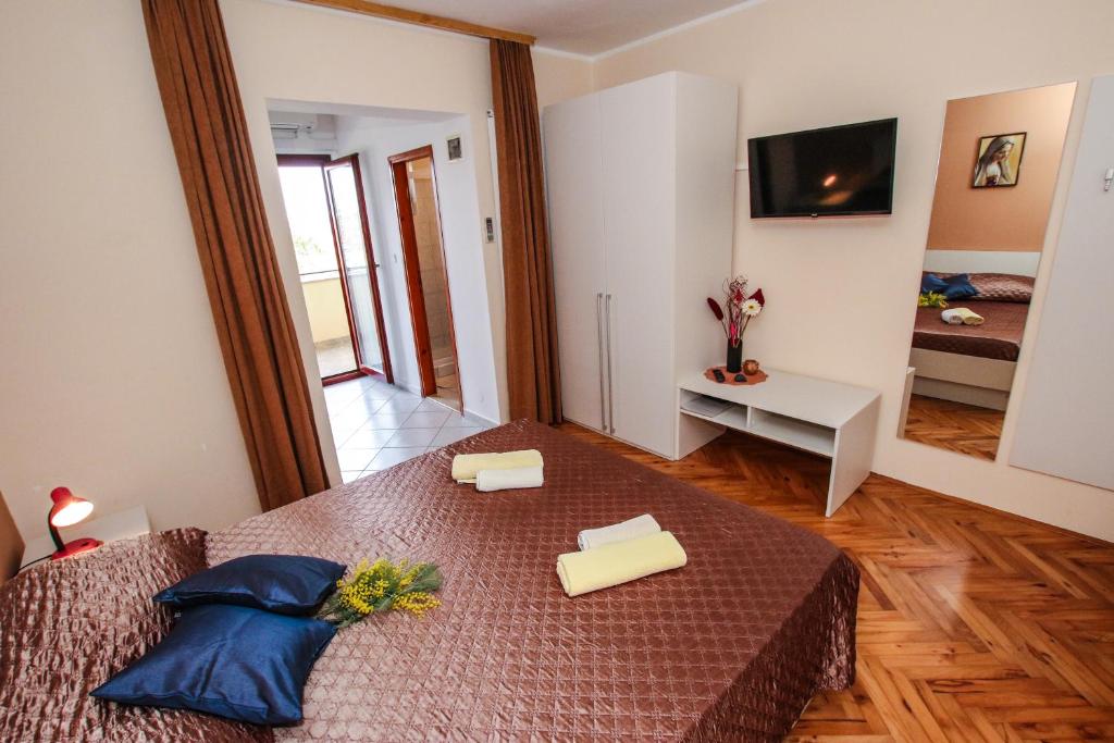 Postel nebo postele na pokoji v ubytování Apartments Ritoša