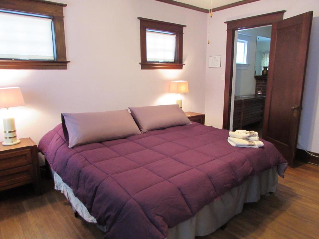 Postel nebo postele na pokoji v ubytování Whirlpool Cottage