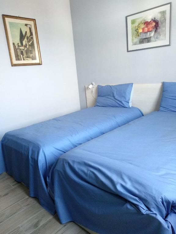 Postel nebo postele na pokoji v ubytování CASCINA PONTETTO