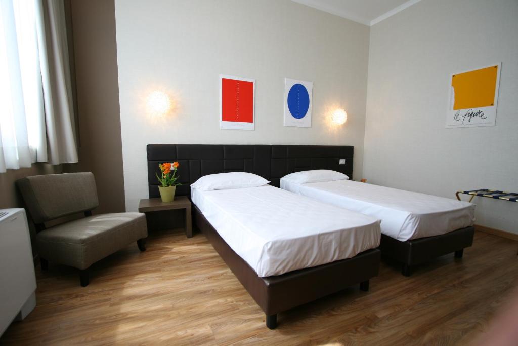 Postel nebo postele na pokoji v ubytování Hotel Oro Blu