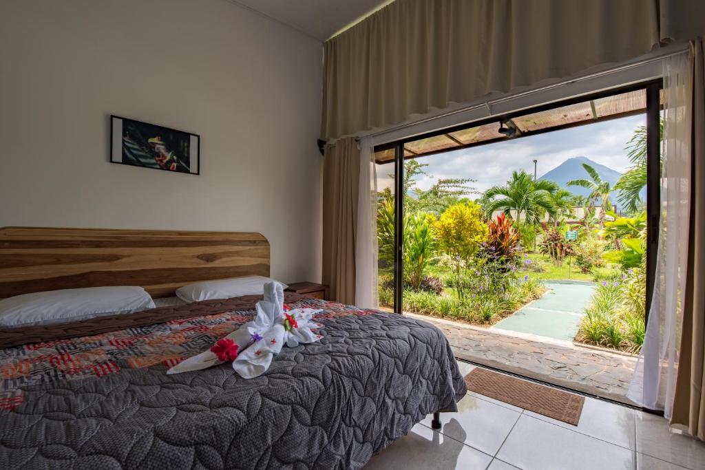 Postel nebo postele na pokoji v ubytování Hotel Secreto La Fortuna