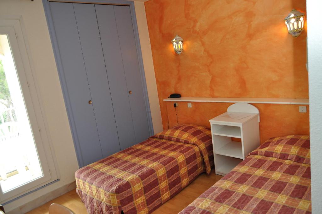 Postel nebo postele na pokoji v ubytování Les Mimosas