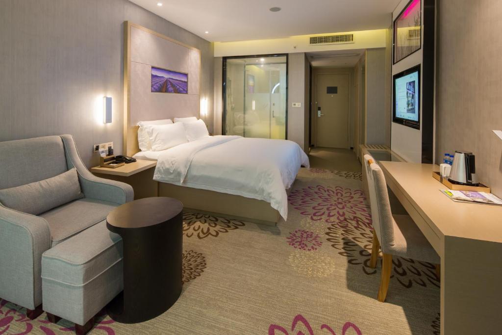 Postel nebo postele na pokoji v ubytování Lavande Hotel Nanhai Sports Center Shishan Town
