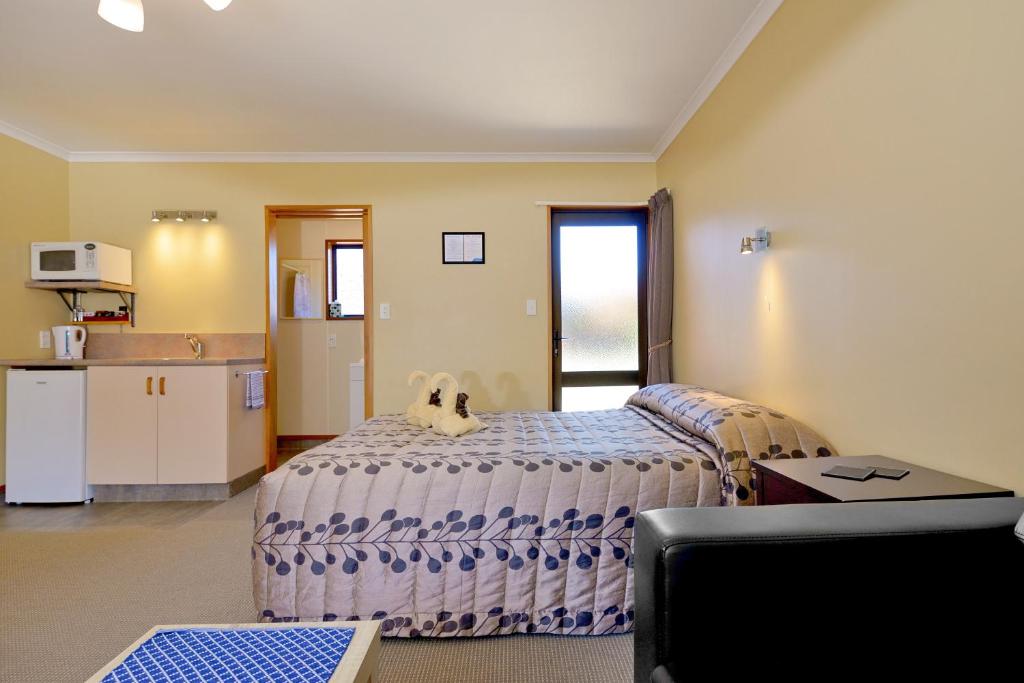 Kuchyň nebo kuchyňský kout v ubytování Mosgiel Regency Motel