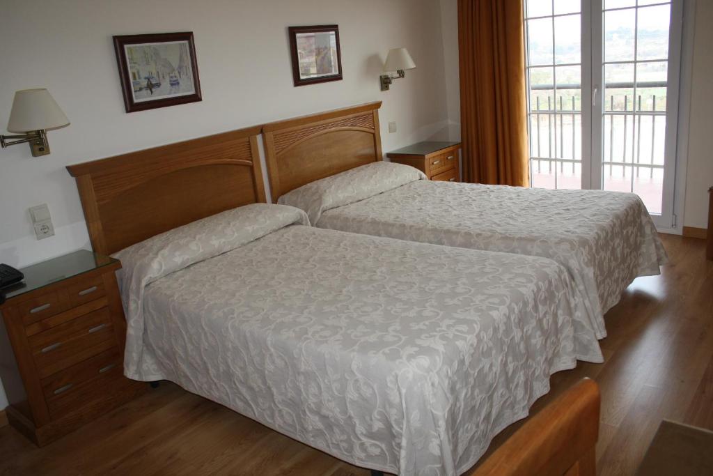 Postel nebo postele na pokoji v ubytování Hotel Mar de Aragón