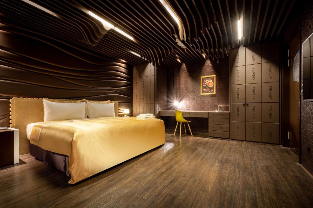 Postel nebo postele na pokoji v ubytování AURORA MOTEL