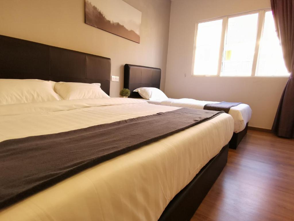 Postel nebo postele na pokoji v ubytování The Core Hotel