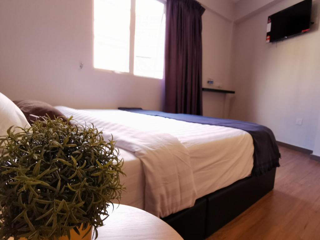 Postel nebo postele na pokoji v ubytování The Core Hotel