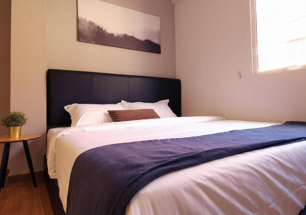 Postel nebo postele na pokoji v ubytování The Core Hotel