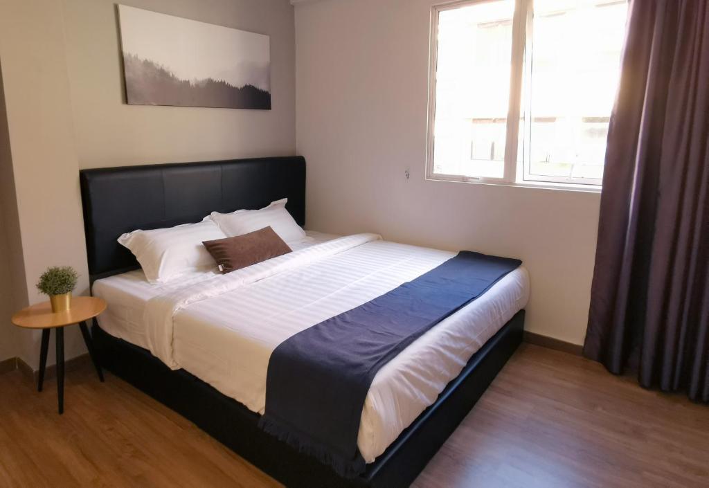 Postel nebo postele na pokoji v ubytování The Core Hotel