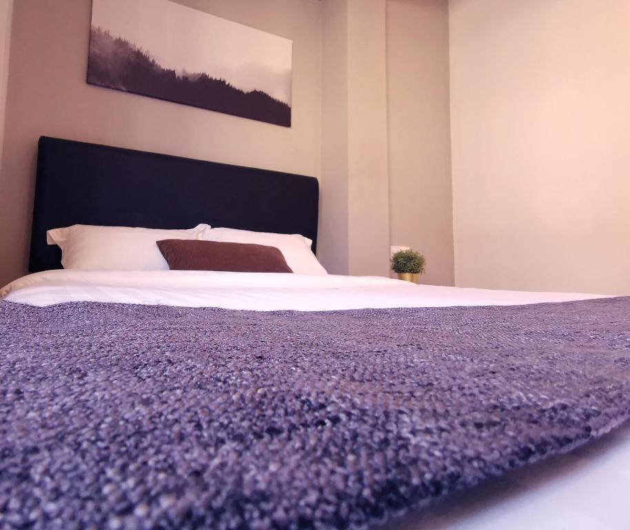 Postel nebo postele na pokoji v ubytování The Core Hotel