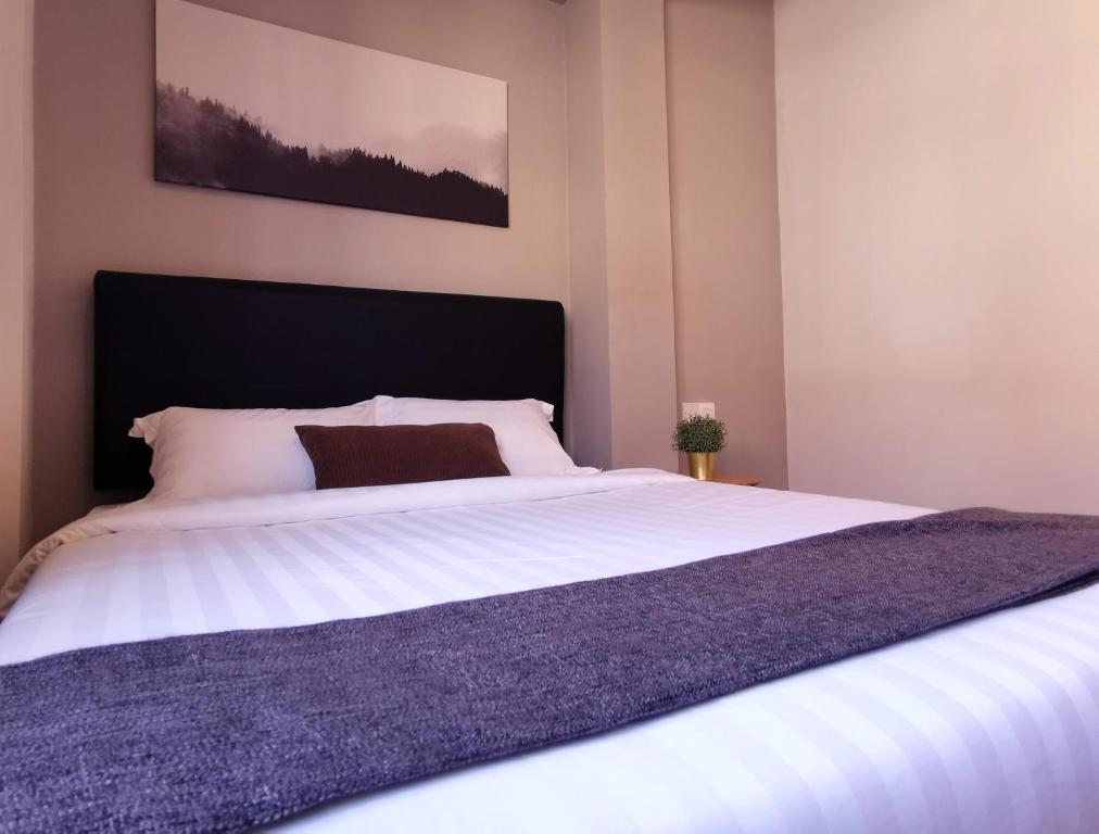 Postel nebo postele na pokoji v ubytování The Core Hotel
