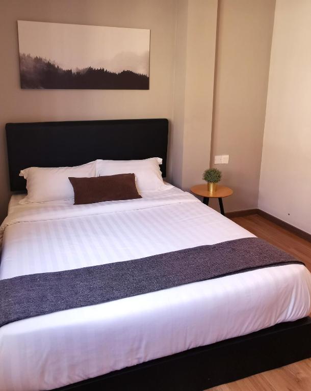 Postel nebo postele na pokoji v ubytování The Core Hotel