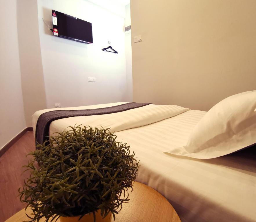 Postel nebo postele na pokoji v ubytování The Core Hotel