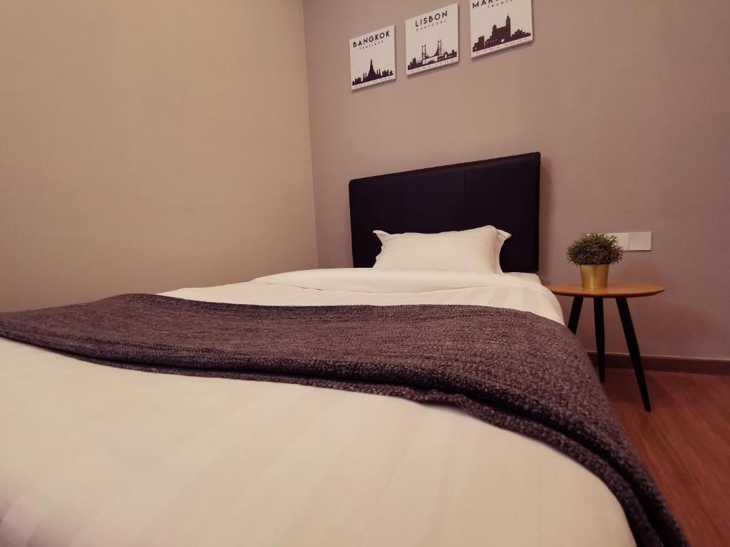 Postel nebo postele na pokoji v ubytování The Core Hotel