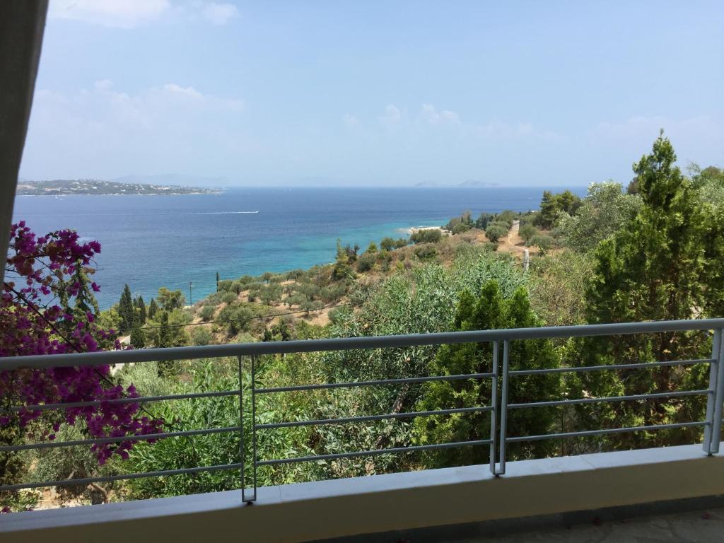 a view of the ocean from a balcony at Lovely Flat With Amazing View in Spetses