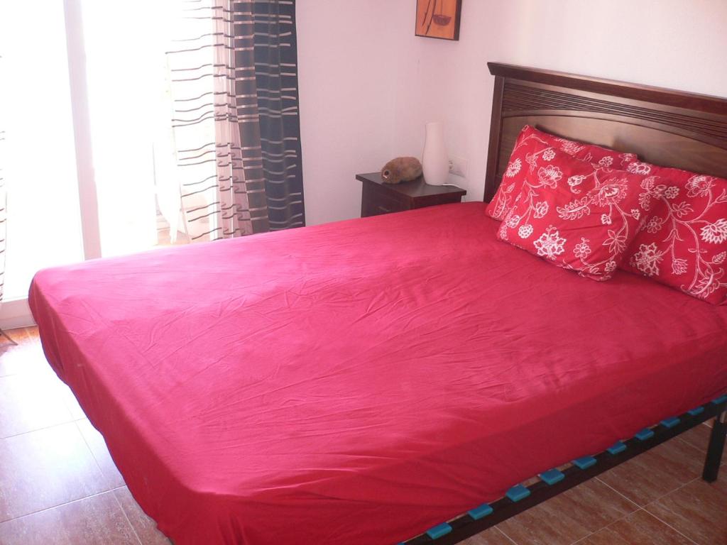 A bed or beds in a room at Miradores Del Puerto One Bedroom Apartment RP019