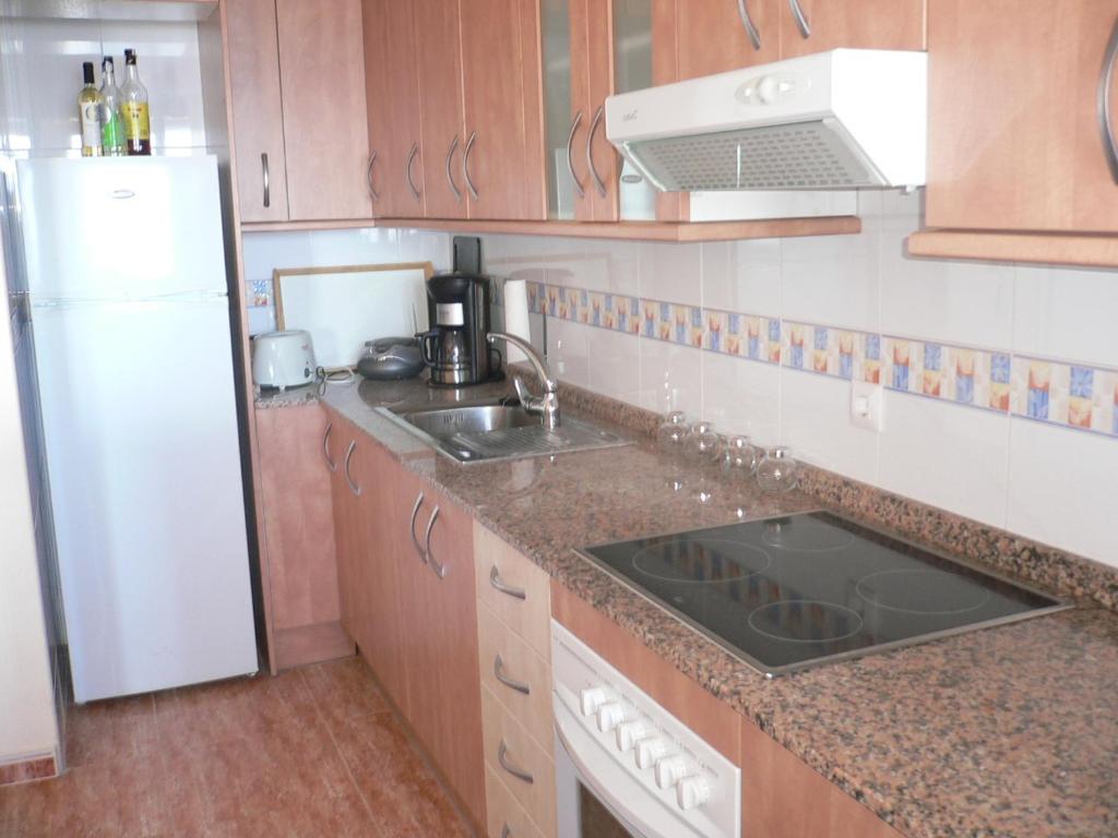 A kitchen or kitchenette at Miradores Del Puerto One Bedroom Apartment RP019