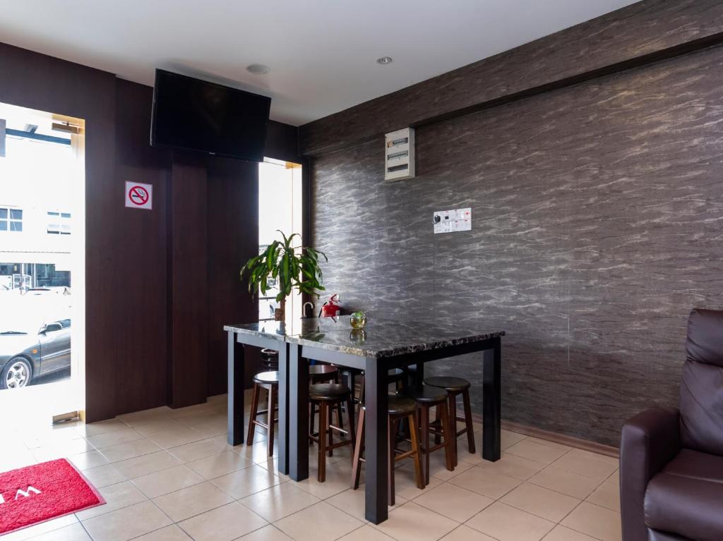Posezení v ubytování I Harmony Hotel