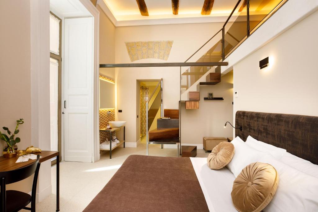 En eller flere senge i et værelse på MelRose Napoli