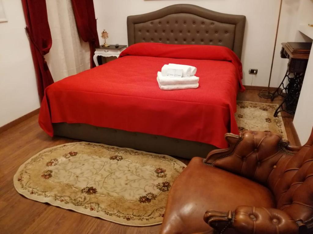 Postel nebo postele na pokoji v ubytování Colosseo Room