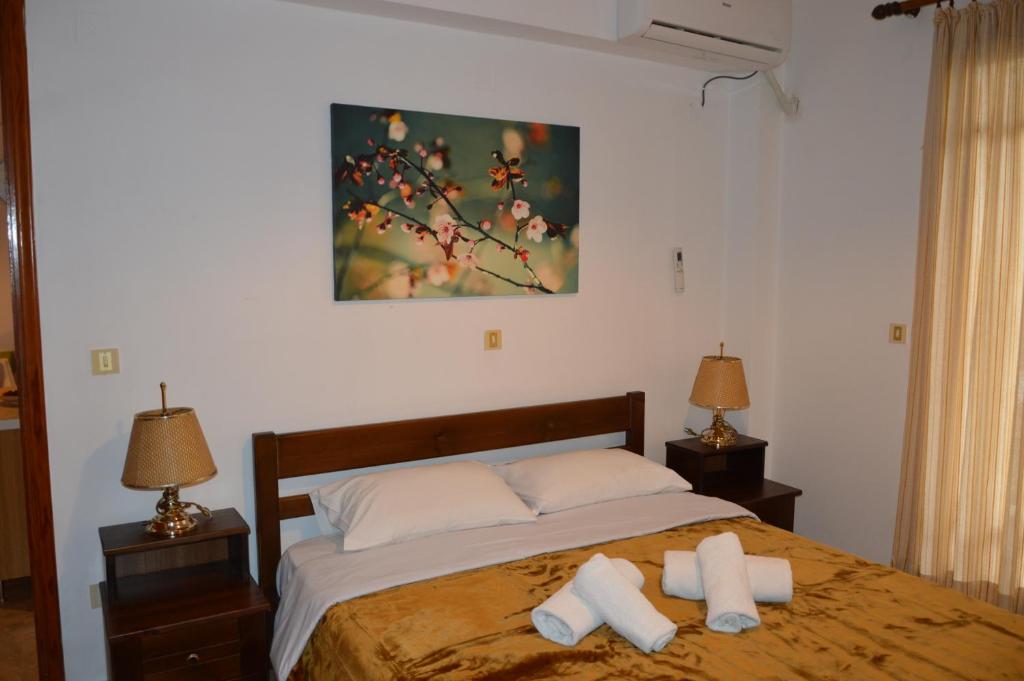 Postel nebo postele na pokoji v ubytování Maria Parameriti Apartments