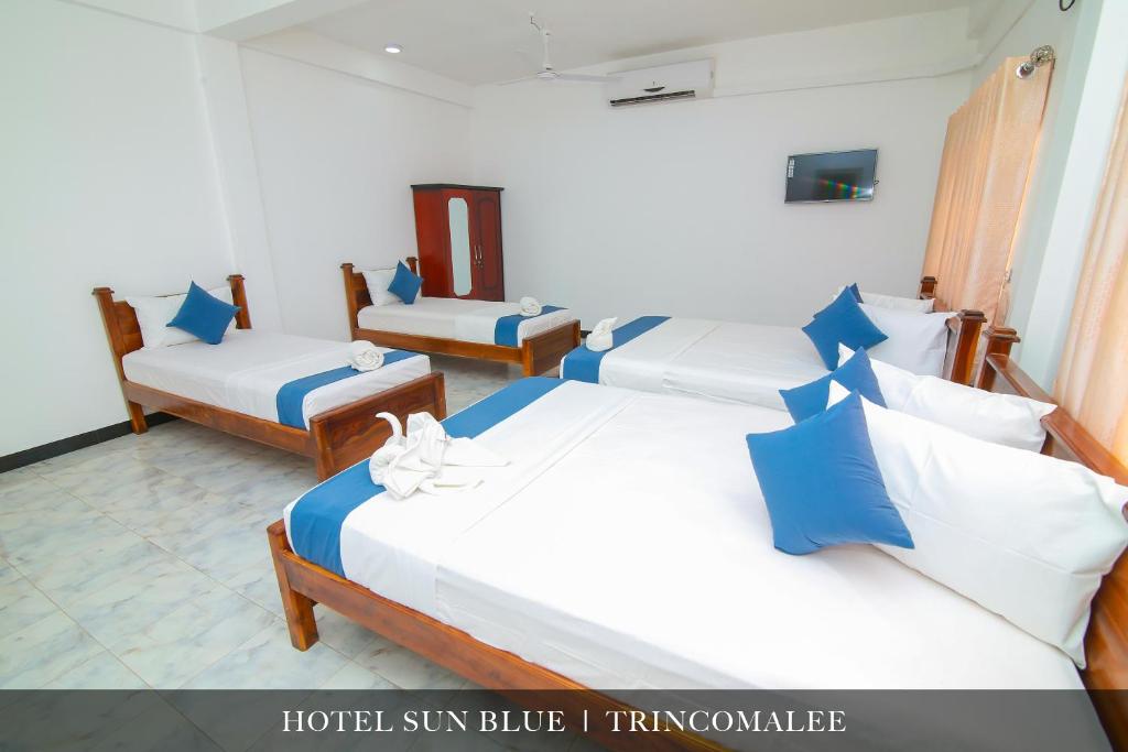 Postel nebo postele na pokoji v ubytování Hotel Sun Blue
