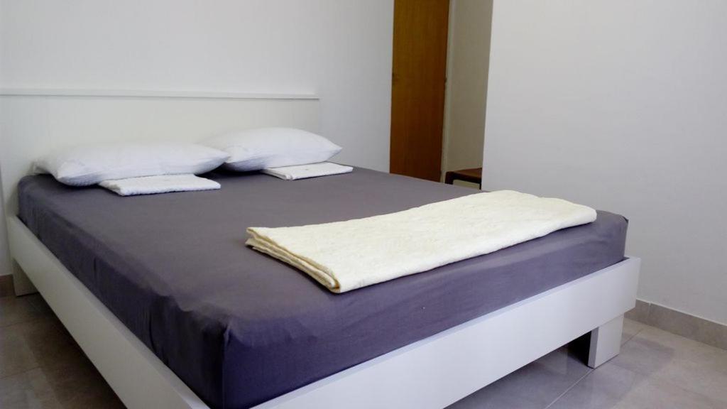 Postel nebo postele na pokoji v ubytování Josipa