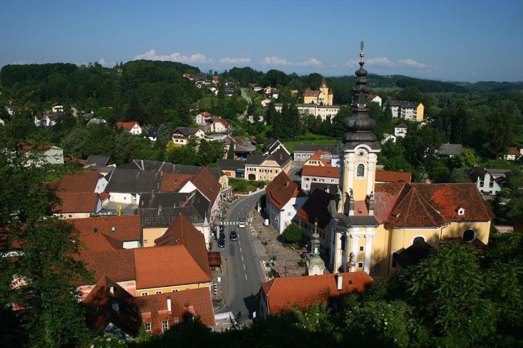 an aerial view of a town with a church at Gasthof zum Goldenen Löwen in Ehrenhausen