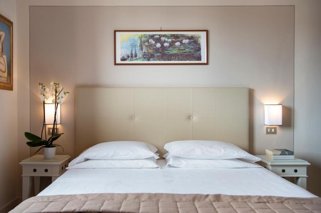 Postel nebo postele na pokoji v ubytování Hotel Ariston & Spa