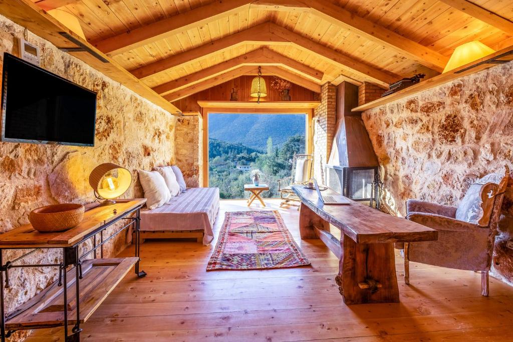 a living room with a couch and a tv at 3 Oda Kaş in Kas