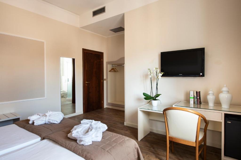 Postel nebo postele na pokoji v ubytování Hotel Ariston & Spa
