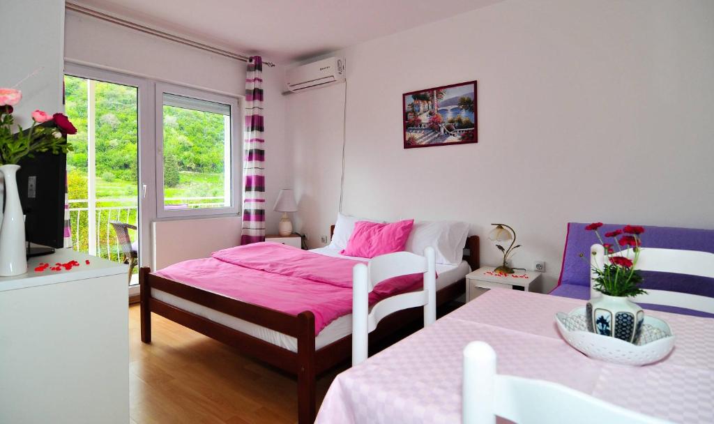 Postel nebo postele na pokoji v ubytování Apartments KOVAC