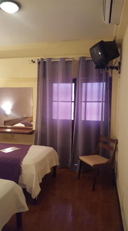 Postel nebo postele na pokoji v ubytování Aparthotel Avenida