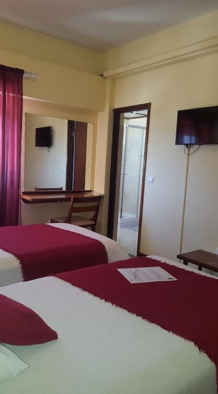 Postel nebo postele na pokoji v ubytování Aparthotel Avenida